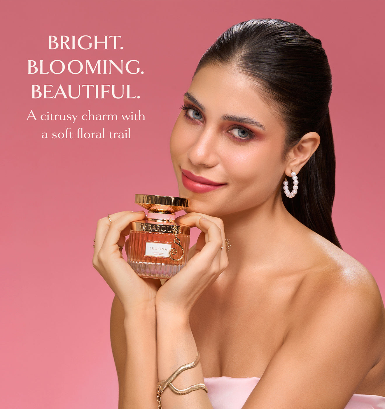 Women holding Embarouge Luxeria Luxury perfume for women Eau De Parfum 100ml lifestyle image